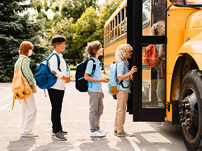 kids-getting-on-a-school-bus-feature